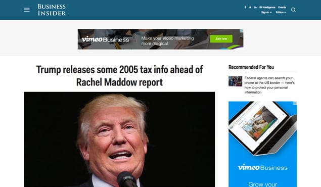 Person writing article on laptop computer