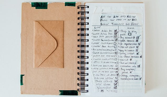 Traveler writing blog post on laptop